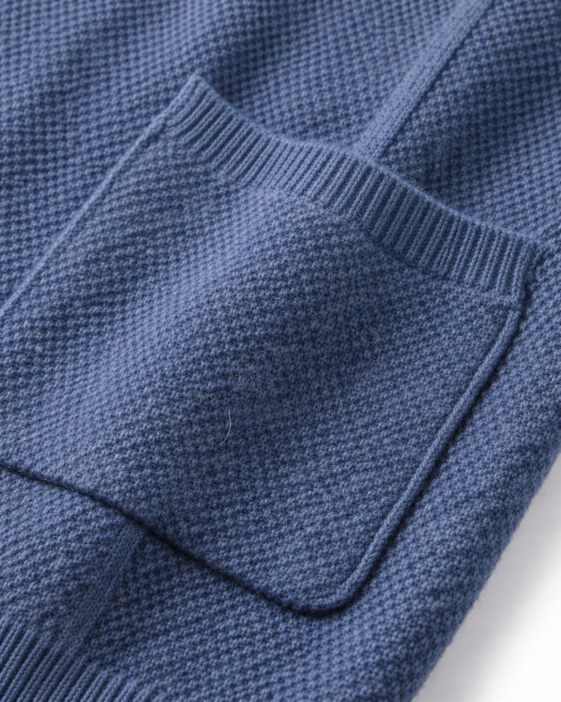 Close-up of the patch pocket on the merino wool overshirt