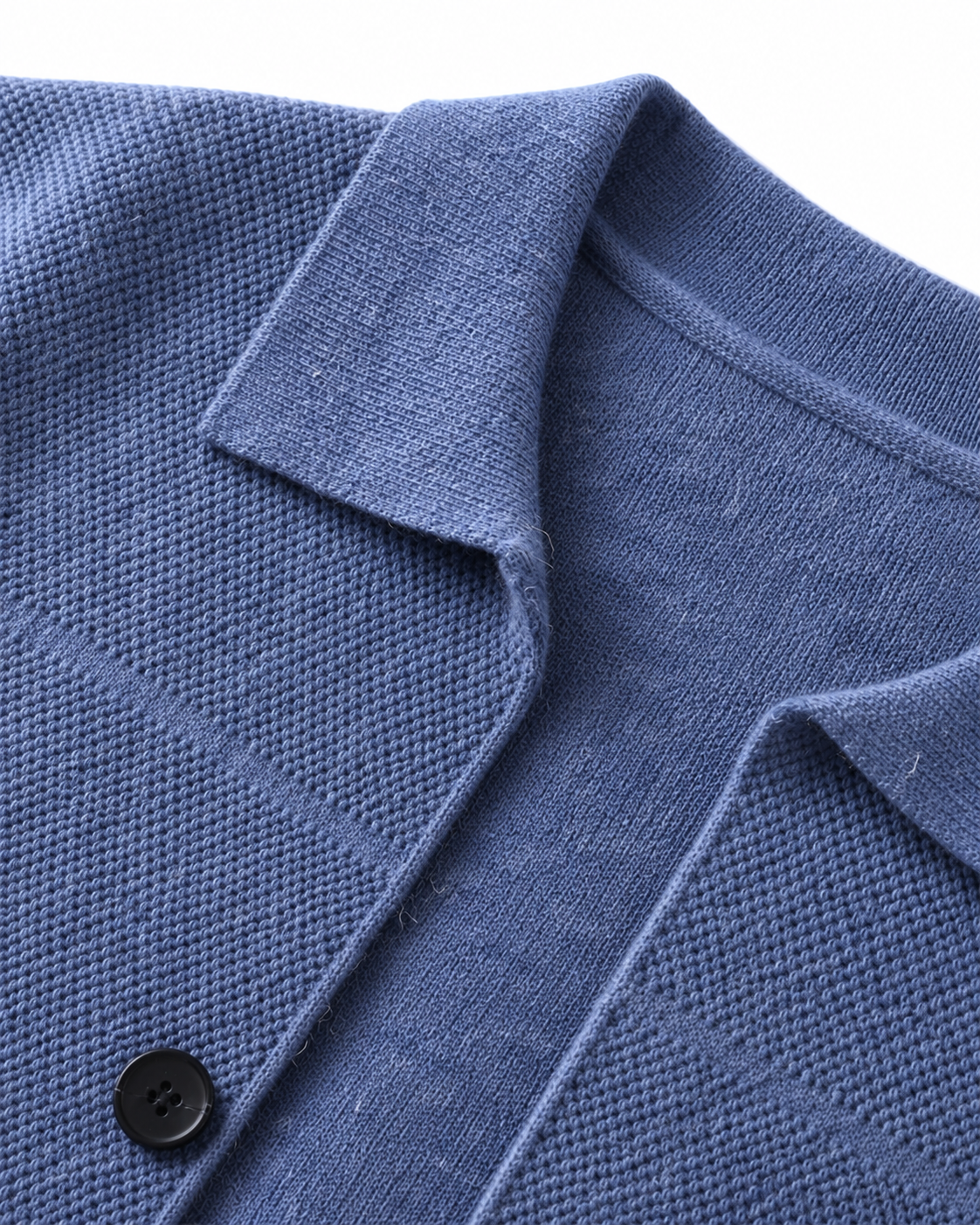Close-up of the collar and button on the sea blue merino overshirt